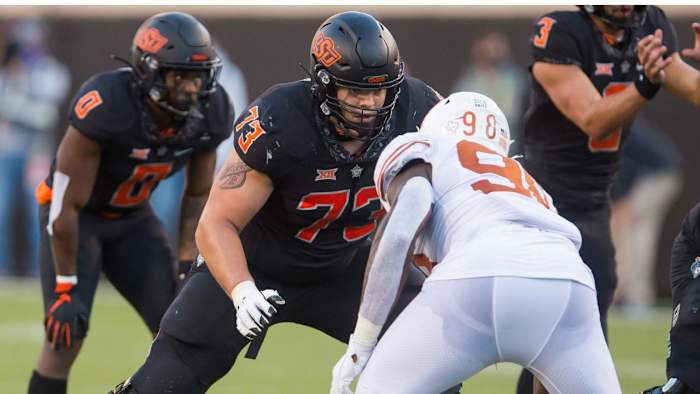 Oklahoma State Cowboys offensive lineman Teven Jenkins (73) blocks Texas Longhorns defensive lineman Moro Ojomo (98) during the fourth quarter at Boone Pickens Stadium.